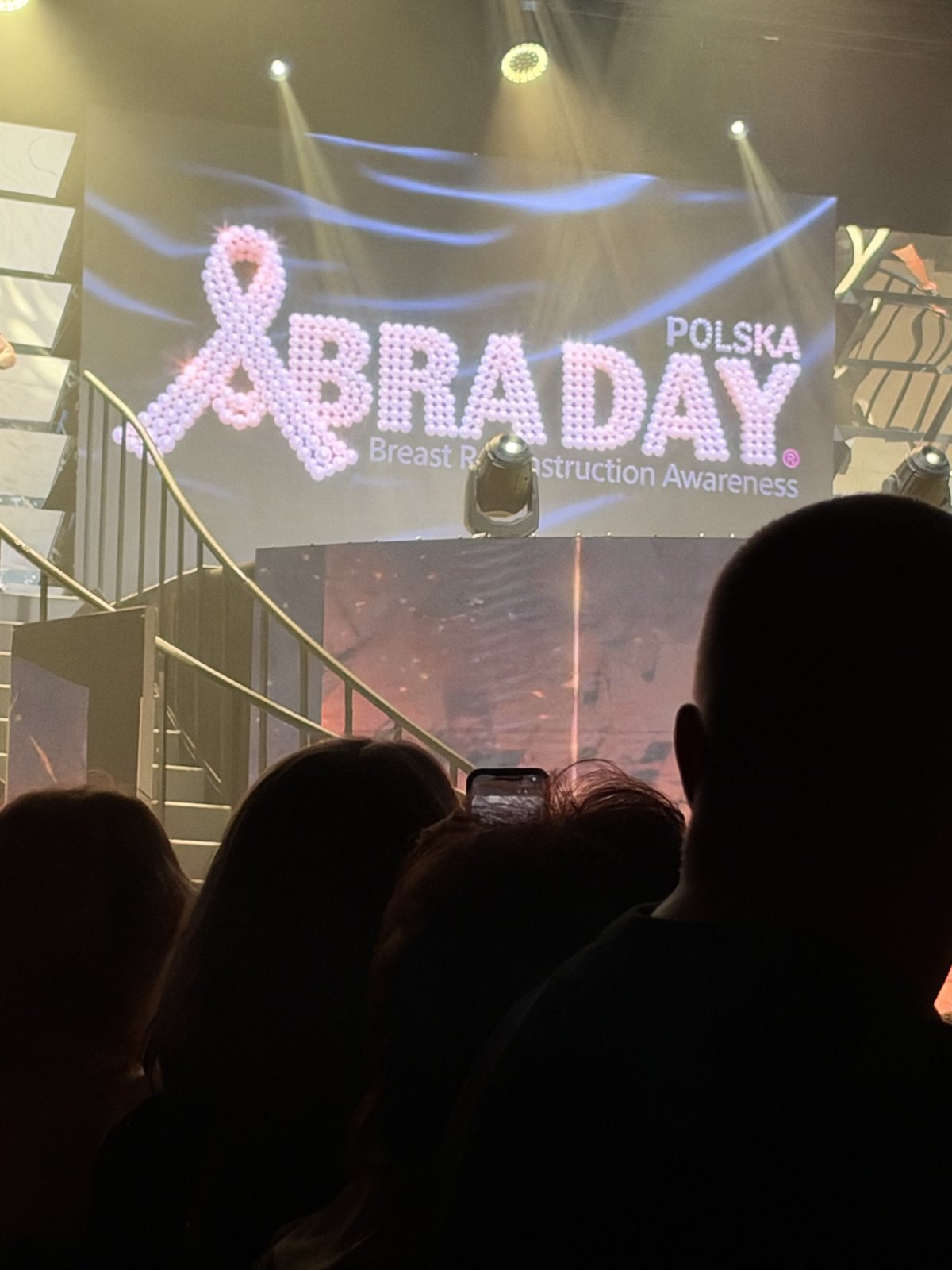 The BRA Day Polska Breast Reconstruction Awareness logo on stage at the gala in Łódź